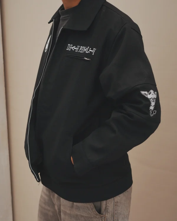 Close view of the embroidered chest panel and sleeve patch